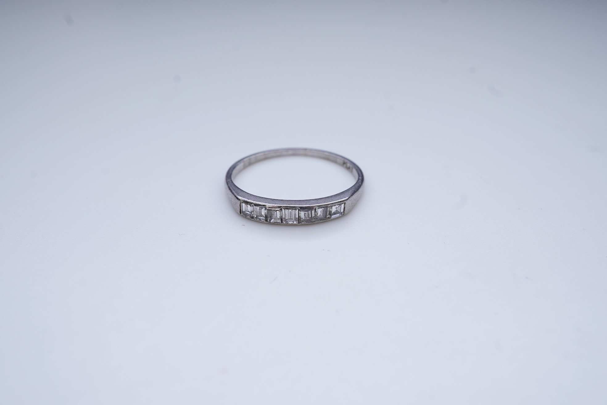 A diamond half-eternity ring, first half 20th century
